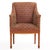 A stylish pair of Italian maple armchairs, circa 1940, featuring a classic barrel-back silhouette with straight crest...