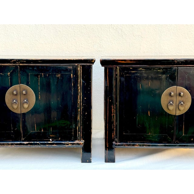 Pair of beautiful vintage wood ebony lacquered chests/ nightstands with brass hardware. Rustic black lacquer finish over...