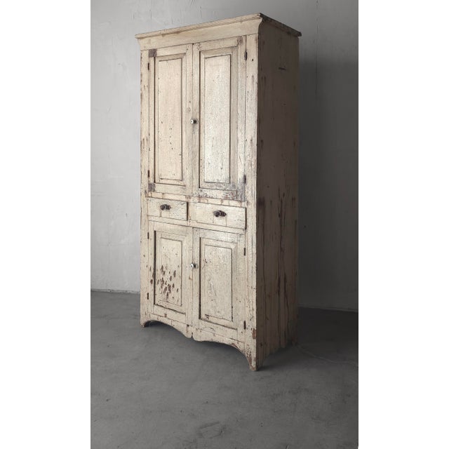 A beautiful example of an antique pantry cabinet. This piece is a true antique with with countless decades of character...