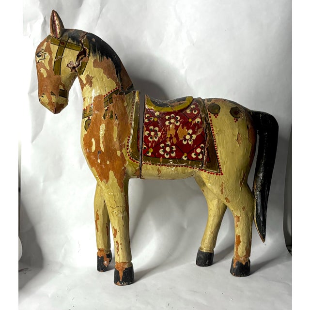 Hand-carved and hand-painted wooden horse from India, likely associated with the folk-art traditions of Rajasthan, dating...