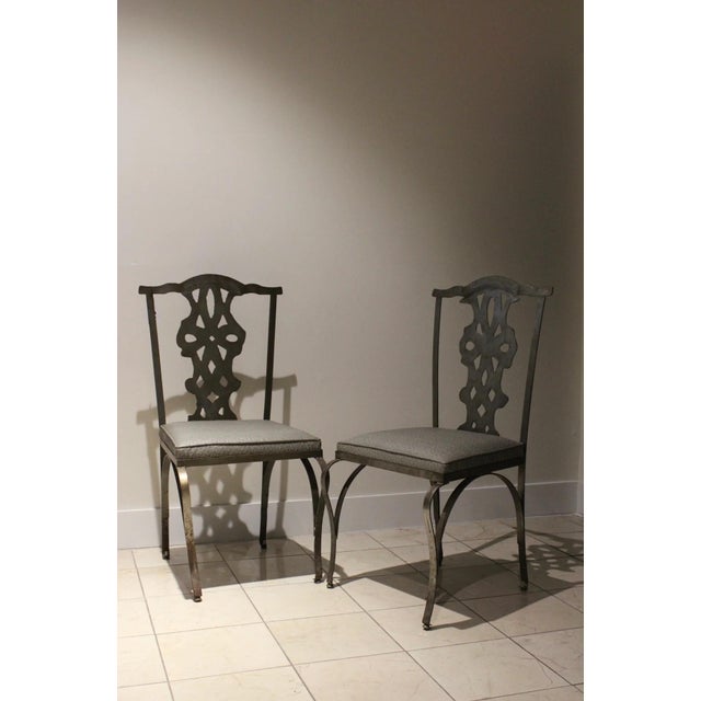 Vintage Chippendale style iron garden chairs with verdigris patina and faux sharkskin upholstery. Heavy architectural...
