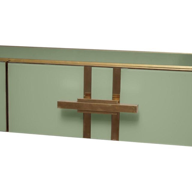 Introducing the Green Glass Modern Console, a masterpiece of contemporary design that combines the timeless elegance of...