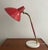 Beautiful desk or table lamp from Stilnovo. Great red shade , base with brasse details and its foot is made of white...