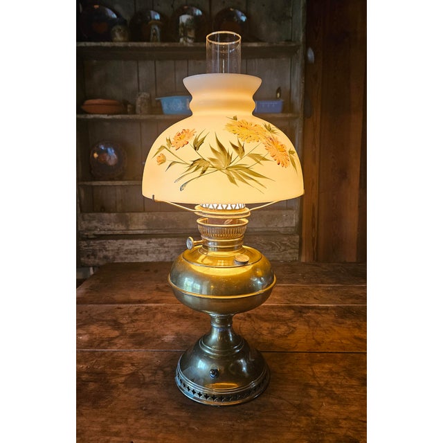 This lamp is a Bradley and Hubbard parlor or "Gone with the Wind" style piece. It’s marked “B & H” on the fuel cap....