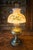 This lamp is a Bradley and Hubbard parlor or "Gone with the Wind" style piece. It’s marked “B & H” on the fuel cap....