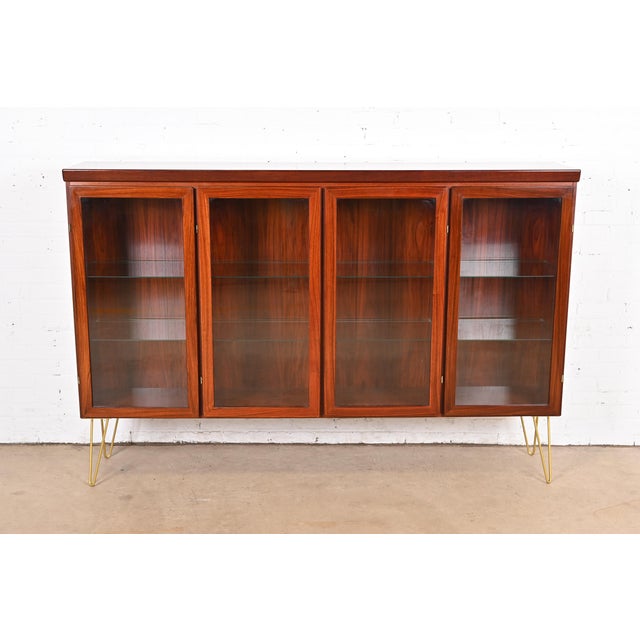 A sleek and stylish mid-century Danish Modern lighted bookcase or display cabinet By Skovby Møbelfabrik Denmark, Circa...