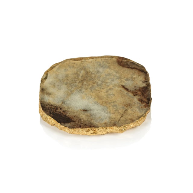 This elegant faux agate coaster set comes in varying colors and brings a slice of cultivated nature to the table. This...