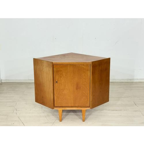 Stylish mid-century corner cabinet from the 1960s. Designed to save space in a corner, this piece impresses with its clean...