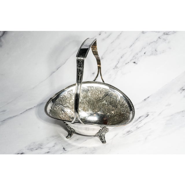 An elegant example of early 20th-century American silverplate craftsmanship, this circa 1920 fruit basket by Wilcox...