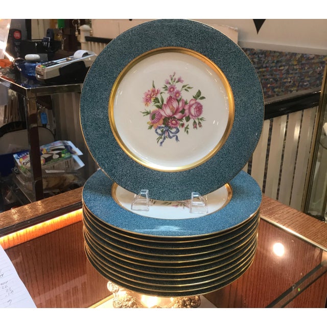 A set of 12 elegant floral service plates made by Theodore Haviland New York. The Dresden floral center with gold band...