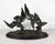 A bronze sculpture signed J.B. Leonard, this twentieth-century French work depicts two seagulls in flight above a wave-...
