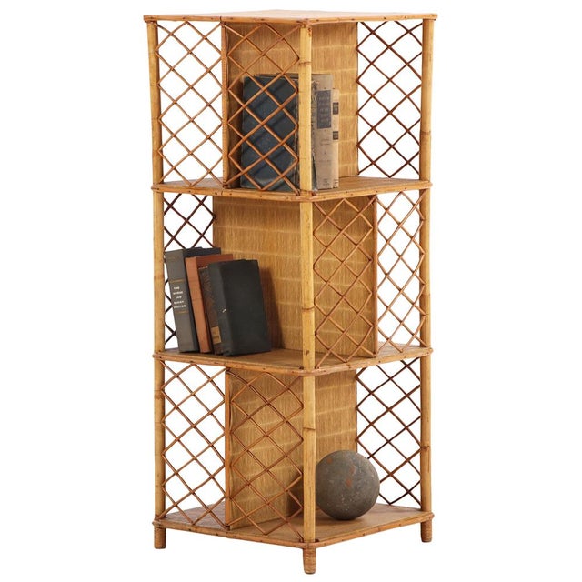 A charming French rattan open bookshelf dating to circa 1950, featuring a clean square form with three open shelves and...