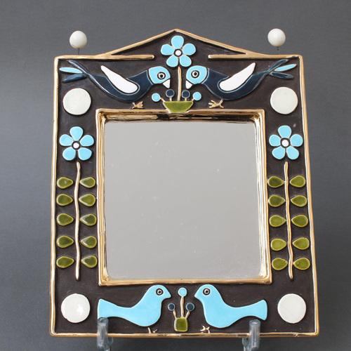 Ceramic wall mirror with birds and flowers (circa 1970s) by Mithé Espelt. A delightful decorative piece topped with two...