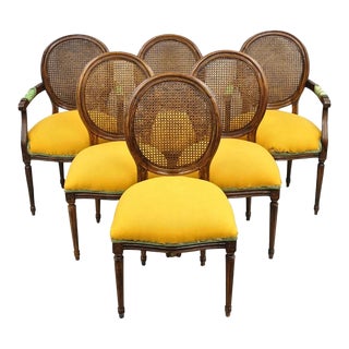 Late 20th Century Vintage French Louis XVI Style Oval Cane Back Walnut Dining Chairs - Set of 6 For Sale
