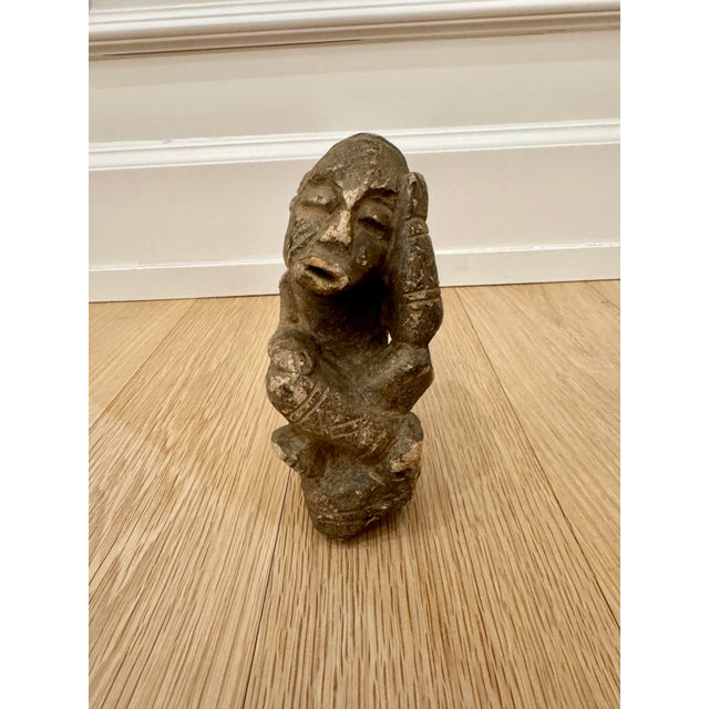 The Story Acquired from the estate of a well-traveled collector, this authentic Nomoli stone figure is a rare piece of...