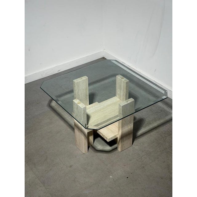 Sculptural travertine side table by belgian designer willy ballez , featuring a geometric architectural base topped with a...