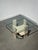 Sculptural travertine side table by belgian designer willy ballez , featuring a geometric architectural base topped with a...