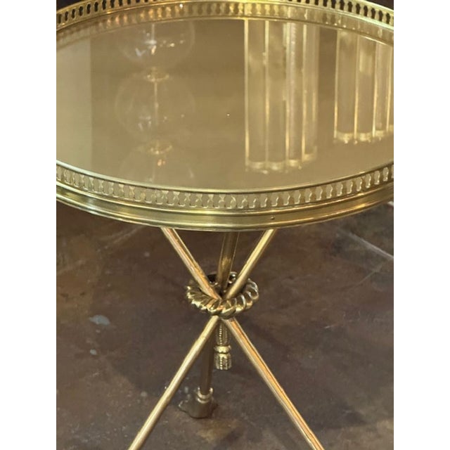 The Italian Jansen Manner Brass Side Table is a stylish and elegant piece of furniture for any home. Made with high-...