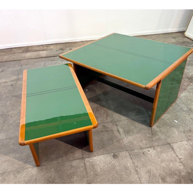 A rare and versatile pair of “Laker” coffee tables designed by Afra & Tobia Scarpa, distinguished by their bold...
