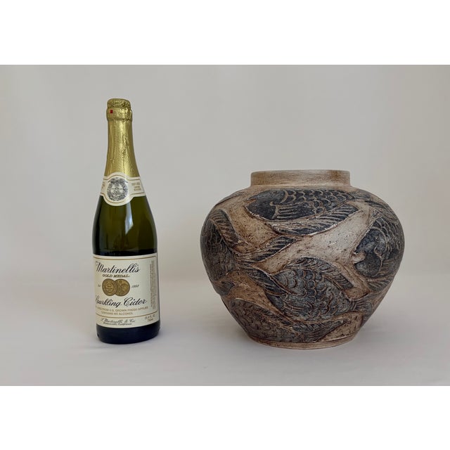 Striking vintage ceramic vase featuring an unusual all-over design of stylized fish rendered in raised relief. The rounded...