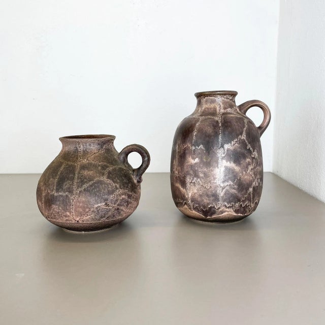 Article: set of 2 vases Producer: Ruscha, Germany Decade: 1960s Description: This original vintage vase set was designed...