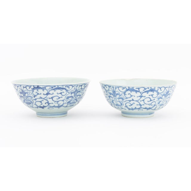 Two Chinese Blue and White Porcelain Bowls, with lotus and scrollwork design, each with blue underglaze six character...