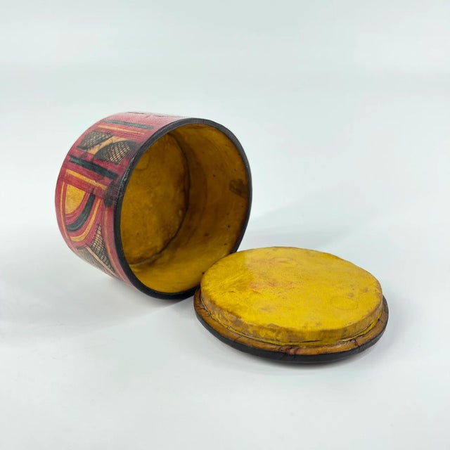 Beautiful Round Wooden box covered in embossed leather and patterns.The Tuareg people, known as the "Blue People" for...