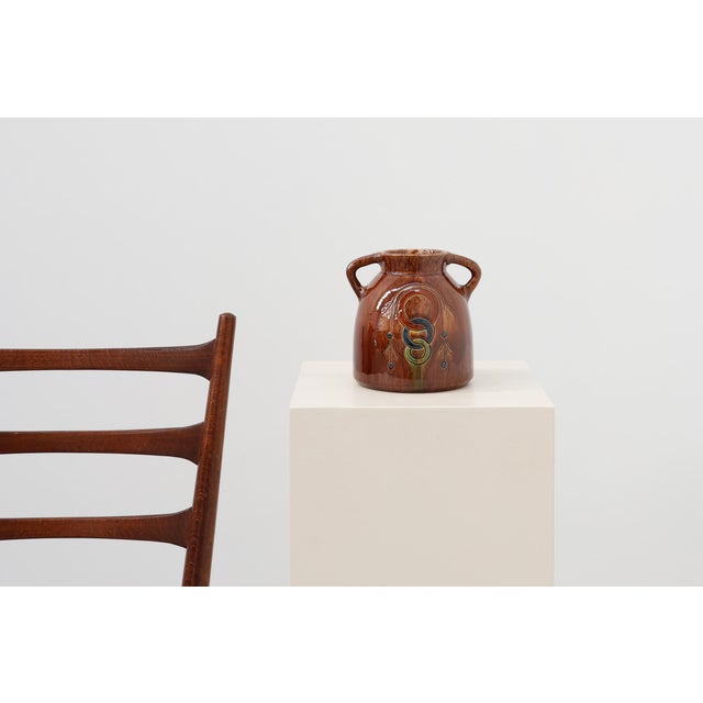 This handcrafted stoneware vessel embodies the quiet refinement of monastic ceramic artistry from the Sint‑Paulusabdij in...