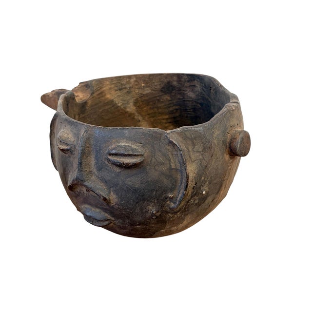 A well carved Kuba wooden cup in the form of a human head. Figural cups such as this cups are among the most popular...