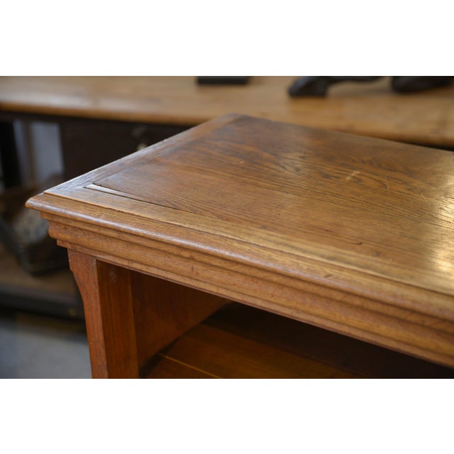 Two solid oak bookcases, with clean, balanced lines typical of the 1920s. The front features a discreet cornice, gently...