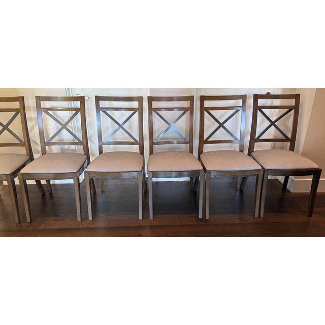 Set of six sophisticated two-tone dining chairs that were made in France by Grange. Made of beech wood, these chairs were...