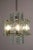Magnificent Italian mid-century crystal chandelier attributed to Zero Quattro per Fontana Arte, the 1960s. Eight nickel-...