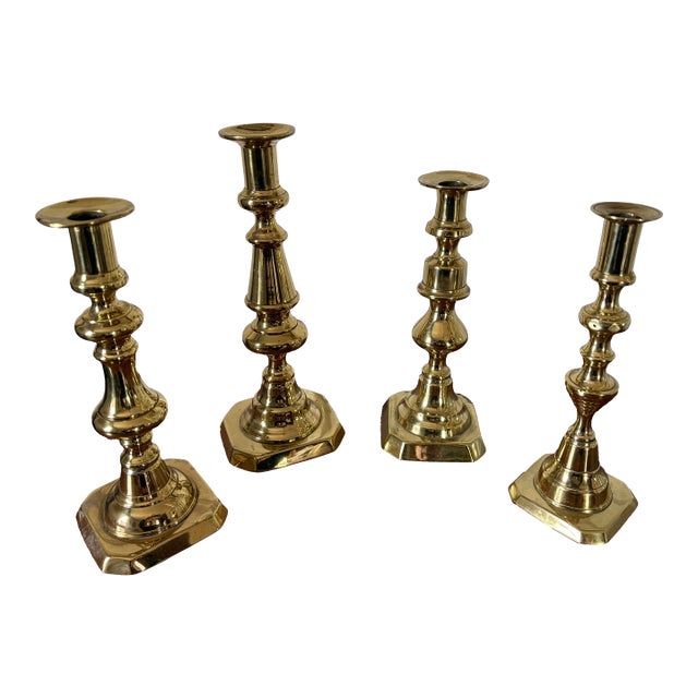 Group of Four English Polished Brass Candlesticks Different Sizes, 19th Century For Sale