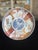A finely decorated Japanese Imari porcelain plate dating to the Meiji period (late 19th century), featuring a central...