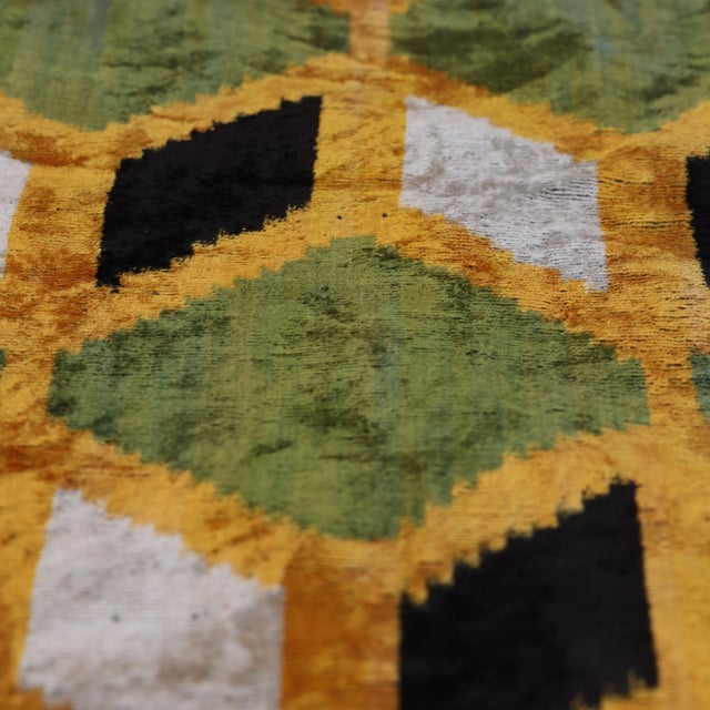 "Introduce a masterwork of Central Asian textile art to your collection with this hand-knotted silk velvet ikat lumbar...