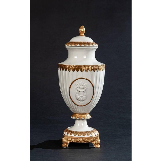Inspired by imperial French design, this Napoleon-style urn is crafted from fine white porcelain and finished with hand-...