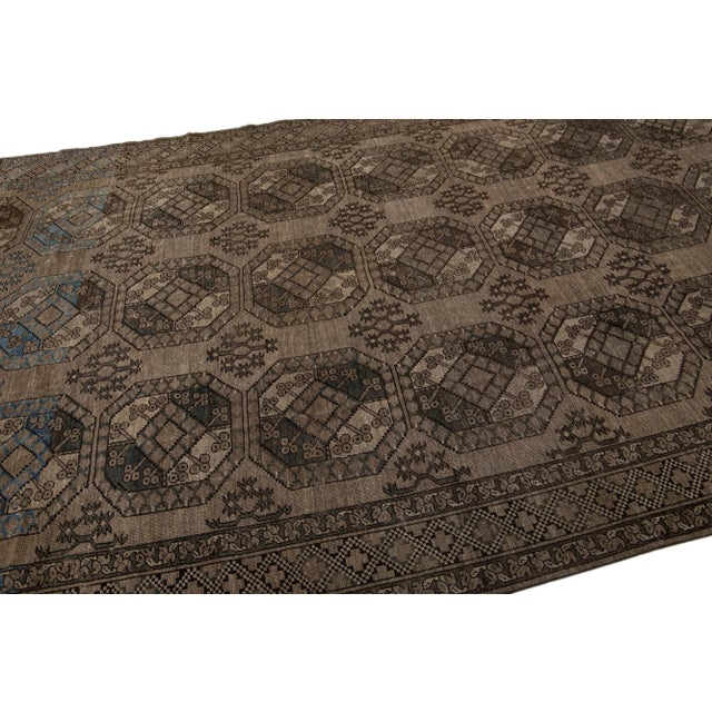 1930s Antique Turkmen Handmade Wool Brown Rug With Gul Design For Sale - Image 4 of 7