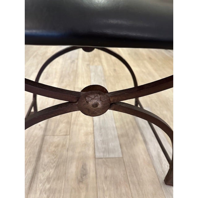 This is a cerule bench with a metal frame and leather seat. The seat is removeable and the base does fold. This could...