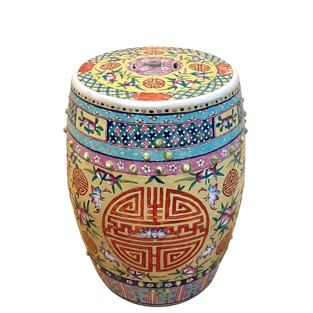 Striking vintage Chinese ceramic garden stool beautifully decorated in a vibrant palette of coral, turquoise, pink, green,...