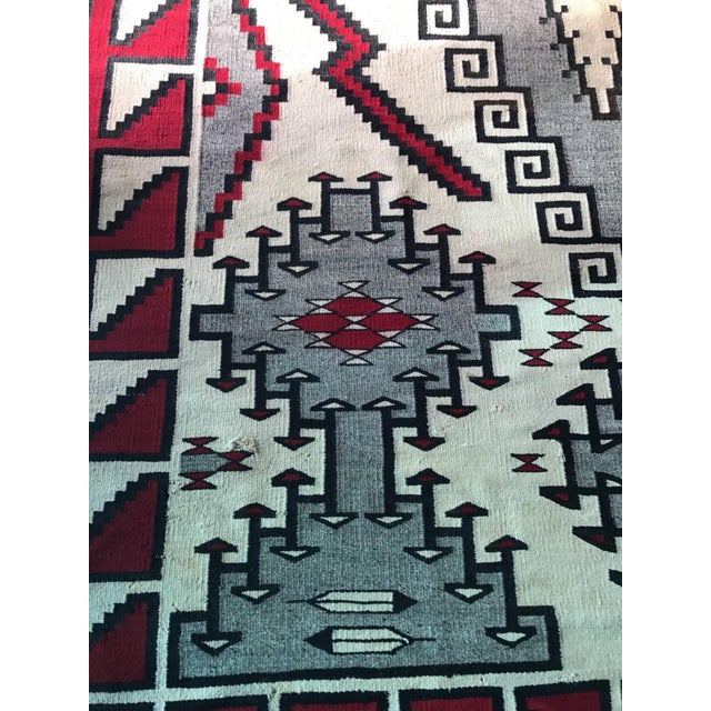 On offer is a rare antique Navajo rug, a truly magnificent piece of textile, circa 1920s-1930s. Distinguished in its...