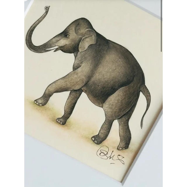 This exquisite miniature painting beautifully captures the essence of an elephant with extraordinary detail and finesse....