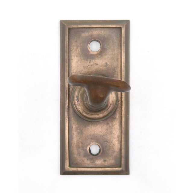 Vintage bronze handrail bracket with a rectangle shaped plate. The original mounting screws are not available. Good...