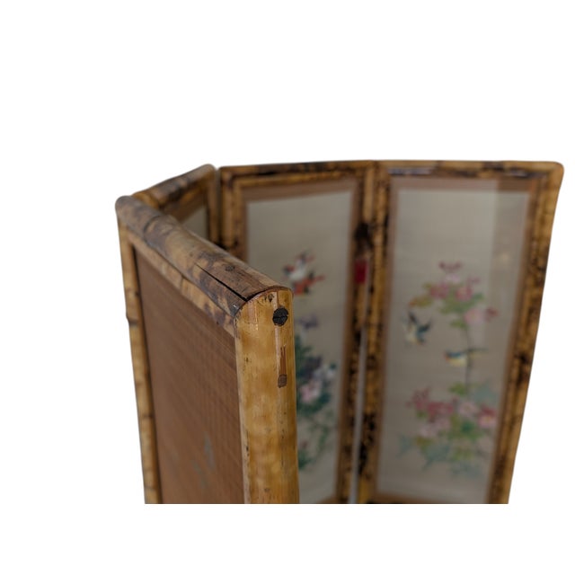 This refined four-panel room divider is a classic example of oriental-inspired craftsmanship, crafted with a tortoiseshell...