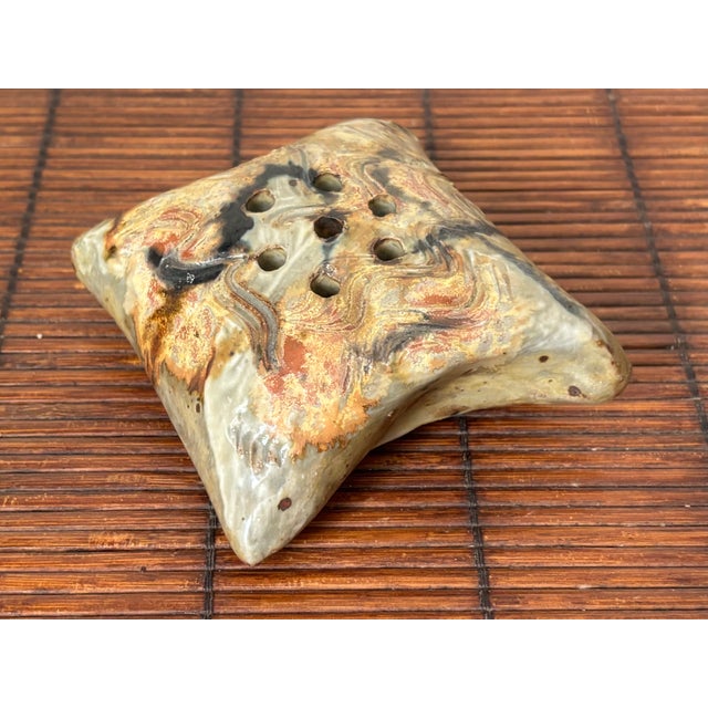 Beautifully glazed pottery flower frog with a puffy pillow-like shape. Signed by maker. Most items found at Pub & Oasis...