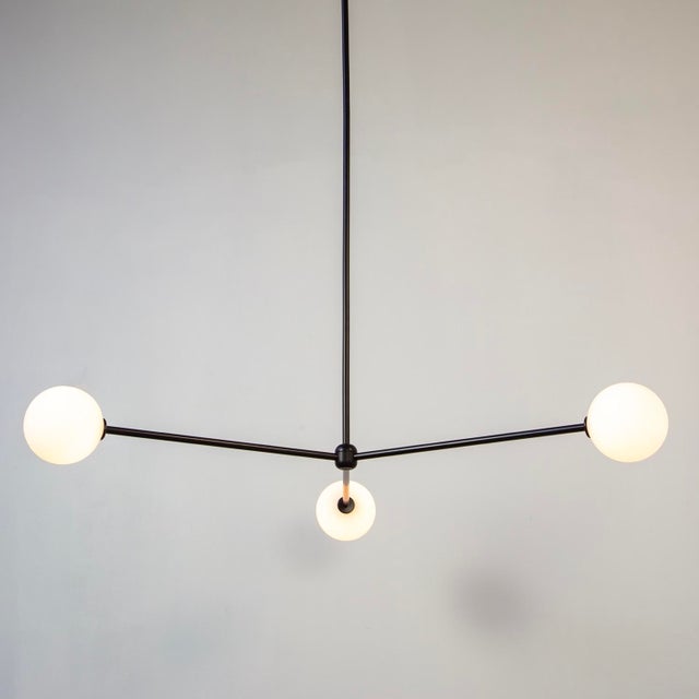 Three orbs, infinite mood. The Globe 3 floats in sync - bright, balanced, and a little bit fun.