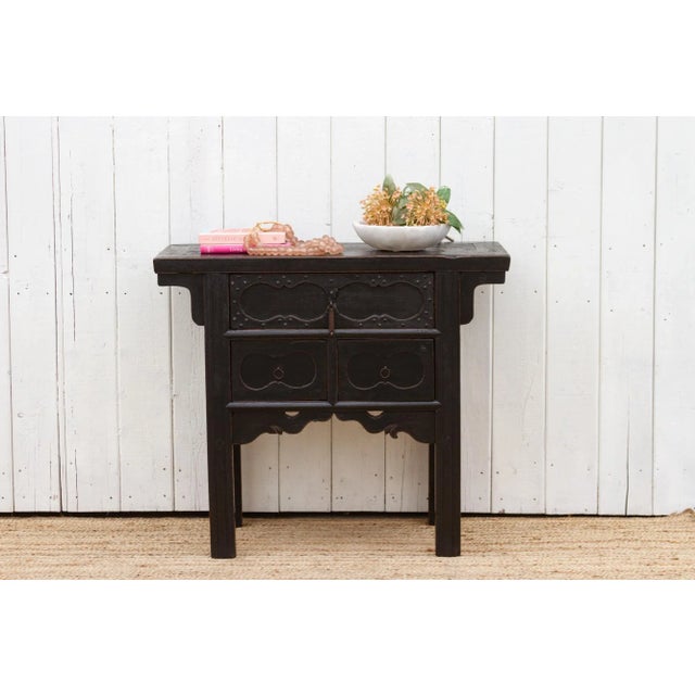 Antique Elm Chinese table with three drawers, a thick top and four fluted legs, this piece is over one hundred years but...