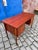 An elegant desk in a classic mid-century modern design, made of fine teak. This model dates back to the 1960s and...
