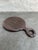 Nice round hand mirror made of Macassar ebony with a beveled mirror insert. The handle is mark “Turtle ____”.