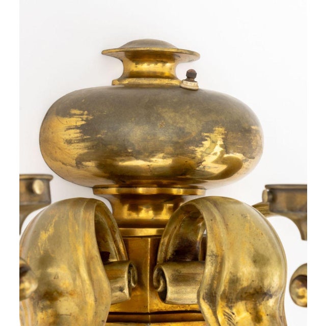 French Empire Style Bronze Three-Branch Wall Sconce, with scroll form arms and urn form support. 13" H x 18" W x 12" D....