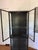 Industrial black iron and glass display cabinet. This is a unique piece for displaying china, dish ware, pottery, books,...
